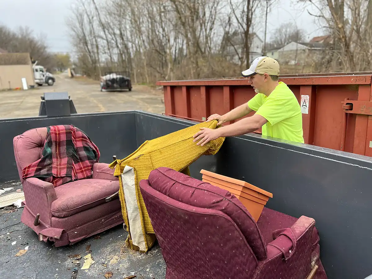 IMG_1657-loading-recliners-in-dumpster-junk-removal-1200x900