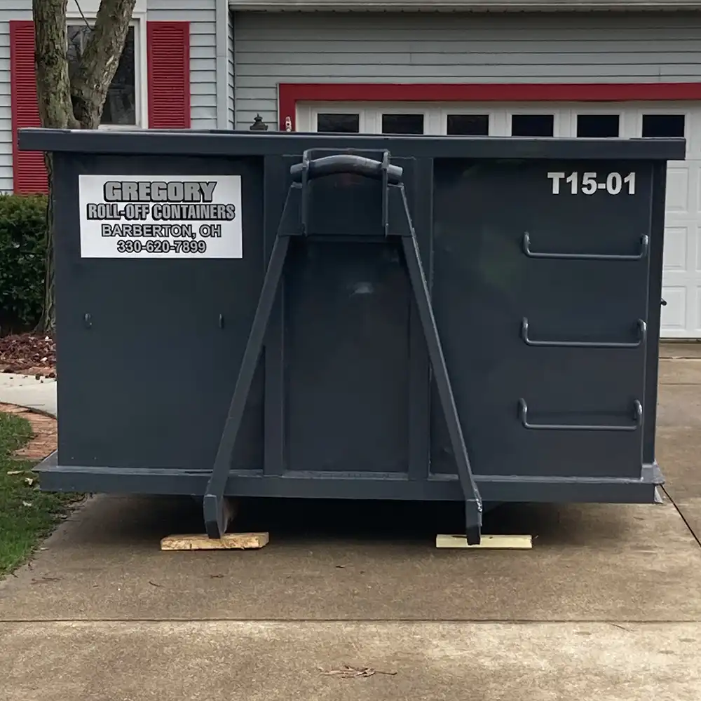 A gray 15-yard dumpster rental in front of a house in Akron, Ohio.