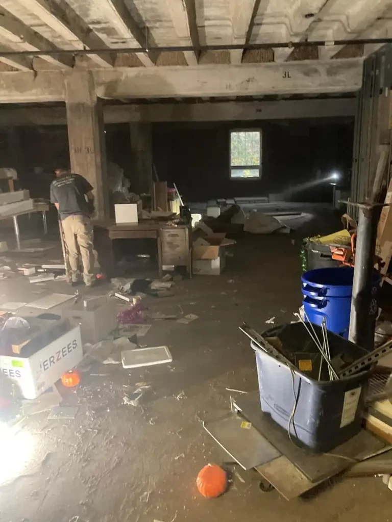 A cluttered room with a lot of debris in it requiring clean-out services in Akron.